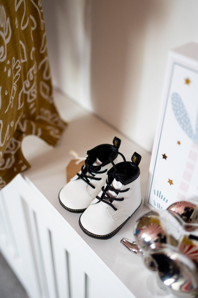 Detail shot of with baby Dr Martens during a home family shoot